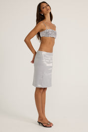Silver satin floral top and silver midi skirt